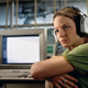 Ellie with a computer monitor. There are A LOT of monitors in the movie.